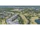 Aerial image of condo building located next to golf course and pond in suburban area at 2621 Cove Cay Dr # 204, Clearwater, FL 33760