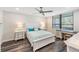 Well-lit bedroom with a bed and matching dressers at 2621 Cove Cay Dr # 204, Clearwater, FL 33760