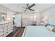 Bright bedroom with a large dresser and access to the bathroom at 2621 Cove Cay Dr # 204, Clearwater, FL 33760