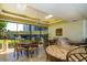 Bright dining area with elegant seating and large windows providing plenty of natural light and scenic views at 2621 Cove Cay Dr # 204, Clearwater, FL 33760