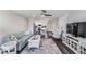 Open-concept living room with contemporary decor and dark wood floors at 2621 Cove Cay Dr # 204, Clearwater, FL 33760