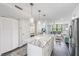 Bright living area with a large island and an open view into the living room area at 2621 Cove Cay Dr # 204, Clearwater, FL 33760