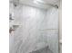 Modern bathroom shower with sleek marble and glass doors at 2621 Cove Cay Dr # 204, Clearwater, FL 33760