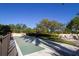 Recreational shuffleboard court surrounded by lush landscaping offering a serene and engaging outdoor amenity at 2621 Cove Cay Dr # 204, Clearwater, FL 33760