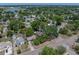 Aerial view of the home surrounded by mature trees, located on a corner lot in a residential neighborhood at 3001 9Th N Ave, St Petersburg, FL 33713
