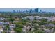 Aerial view of the neighborhood with mature trees and city skyline views, showcasing community amenities and nearby schools at 3001 9Th N Ave, St Petersburg, FL 33713