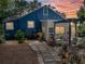 Outdoor seating area in a private backyard with mature landscaping and pavers at 3001 9Th N Ave, St Petersburg, FL 33713