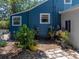 This charming backyard shows mature plants and a stone path at 3001 9Th N Ave, St Petersburg, FL 33713