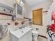 The renovated bathroom features a white sink, tiled walls, and traditional fixtures at 3001 9Th N Ave, St Petersburg, FL 33713
