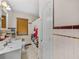 Classic bathroom features a pedestal sink, tiled walls, and vintage fixtures at 3001 9Th N Ave, St Petersburg, FL 33713