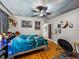 Charming bedroom features unique ceiling design, a ceiling fan, and hardwood floors at 3001 9Th N Ave, St Petersburg, FL 33713
