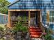 Charming home featuring a cozy front porch with a screened-in area and lush greenery at 3001 9Th N Ave, St Petersburg, FL 33713