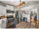 Modern kitchen with stainless steel appliances, ample counter space, and wood-look flooring at 3001 9Th N Ave, St Petersburg, FL 33713