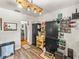 Functional kitchen with wood-look floors, extra cabinets, and easy access to other rooms at 3001 9Th N Ave, St Petersburg, FL 33713