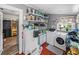 Well-organized laundry room featuring ample storage, a washer, and a dryer at 3001 9Th N Ave, St Petersburg, FL 33713