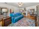 Bright living room featuring a fireplace, hardwood floors, and a colorful rug that adds warmth at 3001 9Th N Ave, St Petersburg, FL 33713