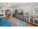 Open-concept living room with hardwood floors, and a view into the dining area, perfect for entertaining at 3001 9Th N Ave, St Petersburg, FL 33713