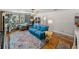 Inviting living room with hardwood floors, a comfortable sofa, and a cat tree for feline friends at 3001 9Th N Ave, St Petersburg, FL 33713