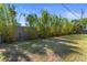 Spacious backyard with a wooden fence, providing privacy and room for outdoor activities at 3112 65Th N Way, St Petersburg, FL 33710