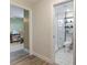 Bathroom boasts patterned tile flooring and a glass enclosed shower with shelving at 3112 65Th N Way, St Petersburg, FL 33710