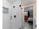 Modern bathroom featuring a glass-enclosed shower with white subway tile and decorative accent tile, and black hardware at 3112 65Th N Way, St Petersburg, FL 33710