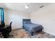 Cozy bedroom with a ceiling fan, double door closet, and a desk area for work or study at 3112 65Th N Way, St Petersburg, FL 33710