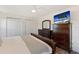 Spacious bedroom features a TV, a dresser, and closet doors providing ample storage at 3112 65Th N Way, St Petersburg, FL 33710