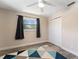 Comfortable bedroom with a window, geometric area rug and a double-door closet for ample storage at 3112 65Th N Way, St Petersburg, FL 33710