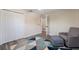 Cozy bedroom features ample closet space, neutral walls, and a comfortable chair at 3112 65Th N Way, St Petersburg, FL 33710