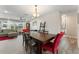 Dining room with a large wooden table, bright lighting, and view to the living room at 3112 65Th N Way, St Petersburg, FL 33710