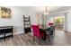 Dining room features a large table, modern decor, and access to an outdoor space at 3112 65Th N Way, St Petersburg, FL 33710