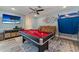 Spacious game room with pool table, large TV, comfortable seating, and stylish decor, perfect for entertainment at 3112 65Th N Way, St Petersburg, FL 33710