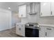 Modern kitchen features white cabinetry, stainless steel appliances, and subway tile backsplash at 3112 65Th N Way, St Petersburg, FL 33710