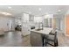 Modern kitchen featuring white cabinets, stainless steel appliances, and an island with seating at 3112 65Th N Way, St Petersburg, FL 33710