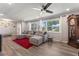 Bright living area featuring wood floors, comfortable seating, and ample natural light at 3112 65Th N Way, St Petersburg, FL 33710