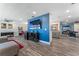 Open living room with a TV, modern furnishings, and a seamless flow to the kitchen at 3112 65Th N Way, St Petersburg, FL 33710