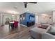 Open-concept living room and dining area boasting wood flooring, stylish decor and ample lighting at 3112 65Th N Way, St Petersburg, FL 33710