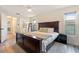 Bright main bedroom with a large bed, windows, and an en suite bathroom at 3112 65Th N Way, St Petersburg, FL 33710
