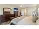 Spacious primary suite featuring a king bed, dresser, and a view into the en suite bath at 3112 65Th N Way, St Petersburg, FL 33710