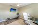 Home office featuring a glass desk and a rowing machine for a quick workout break at 3112 65Th N Way, St Petersburg, FL 33710