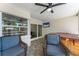 Outdoor patio with comfortable seating, a hot tub, and a TV, creating a perfect space for relaxation and entertainment at 3112 65Th N Way, St Petersburg, FL 33710