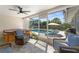 Enclosed patio with comfortable seating overlooking the pool and backyard at 3112 65Th N Way, St Petersburg, FL 33710