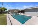 Backyard features a refreshing pool, lounge chairs, and well-maintained landscaping at 3112 65Th N Way, St Petersburg, FL 33710