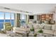 Stylish bar area connected to the living room, featuring a water view and a fully stocked bar at 3301 Bayshore Blvd # 2401E, Tampa, FL 33629