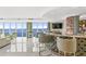 Upscale bar area with a stylish counter, shelves, and water views at 3301 Bayshore Blvd # 2401E, Tampa, FL 33629
