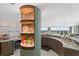 Stunning wet bar area with custom shelving, beverage cooler, marble counter and expansive cityscape views from living area at 3301 Bayshore Blvd # 2401E, Tampa, FL 33629