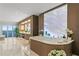 Bright, modern bathroom features double vanity, soaking tub, and floor to ceiling windows at 3301 Bayshore Blvd # 2401E, Tampa, FL 33629