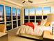 Bright bedroom boasts floor-to-ceiling windows with city views and stylish decor at 3301 Bayshore Blvd # 2401E, Tampa, FL 33629