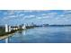 Picturesque view of a city skyline meeting a tranquil bay under a blue sky with fluffy clouds at 3301 Bayshore Blvd # 2401E, Tampa, FL 33629