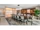 Beautiful dining room with marble accent wall, modern lighting, and wine storage, with seating for twelve at 3301 Bayshore Blvd # 2401E, Tampa, FL 33629